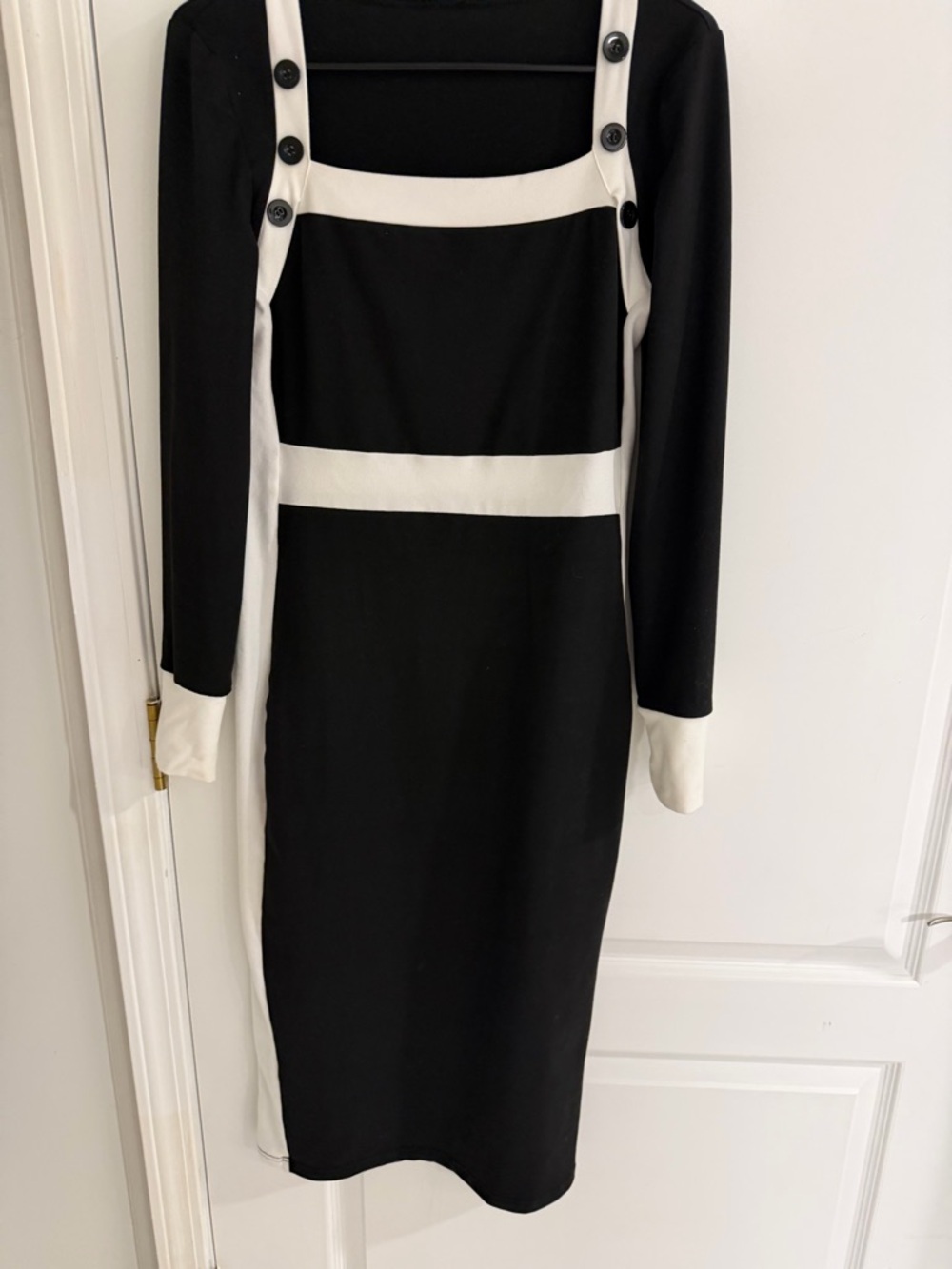 Shin length black and white dress